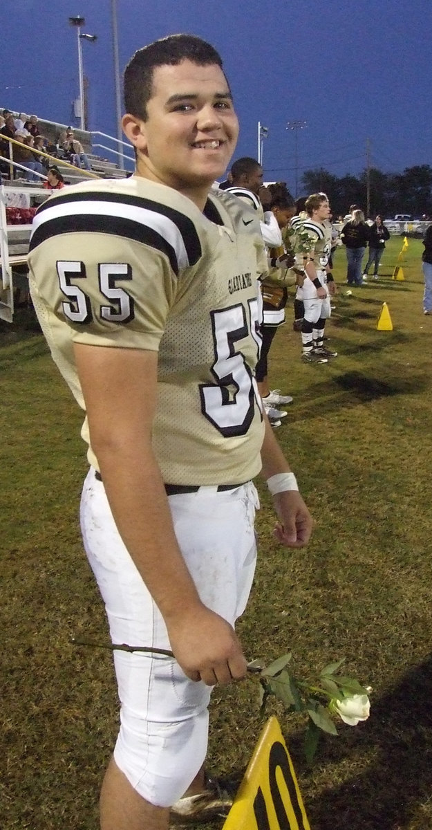 Image: Ross’s sensitive side — Senior lineman Ross Enriquez smiles before joining his parents on Senior Night.