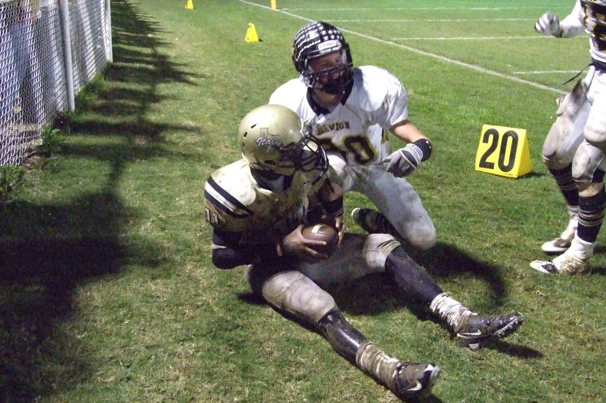 Image: Anderson gets first down — Anderson gets slung out-of-bounds after running for a first down against Dawson.