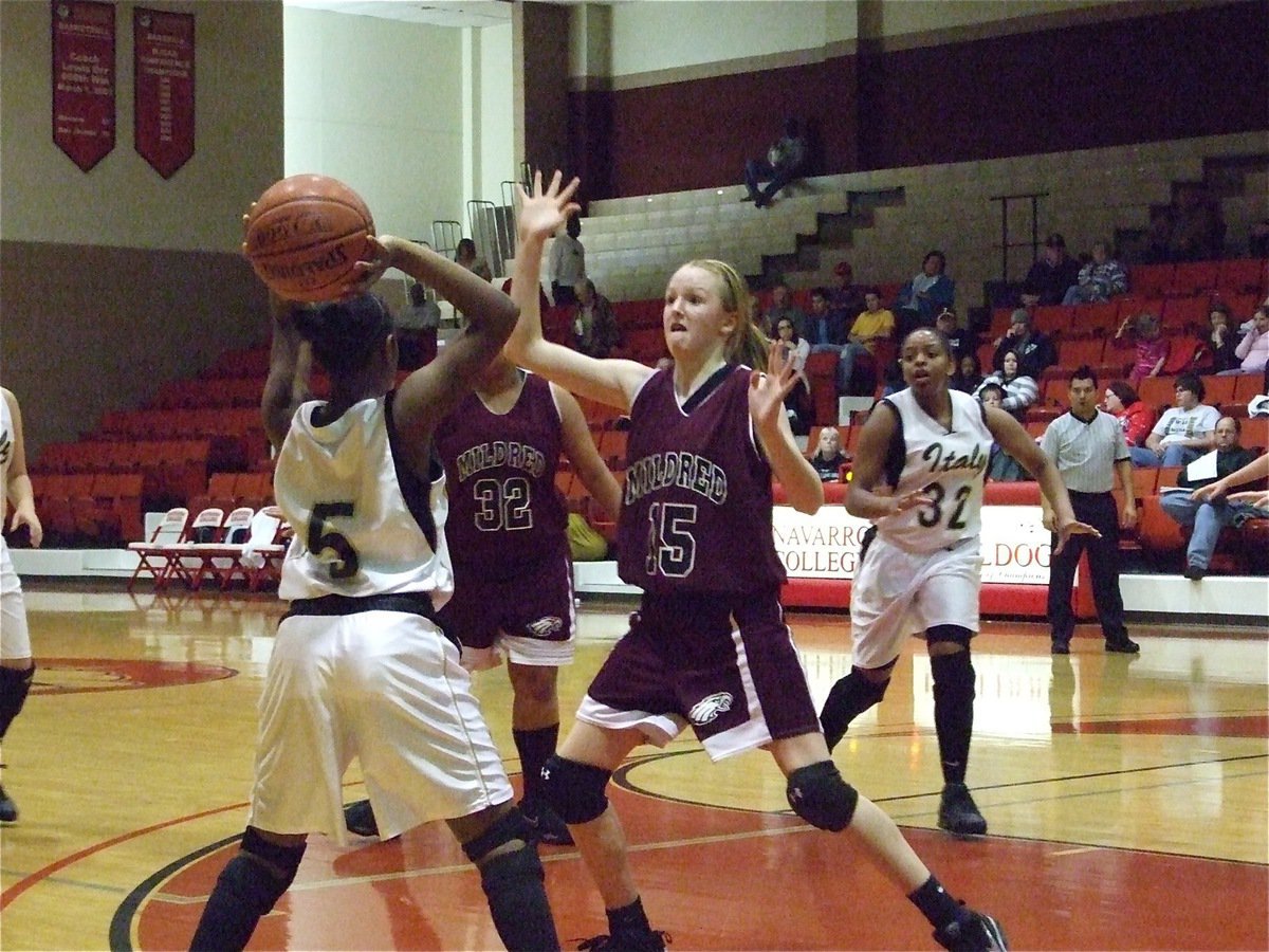 Image: Lady Gladiators battle Mildred for the Consolation Championship — Jameka Copeland(5) tries passing to teammate Jaleecia Fleming(32) during their Consolation Championship clash with the Mildred Lady Eagles.