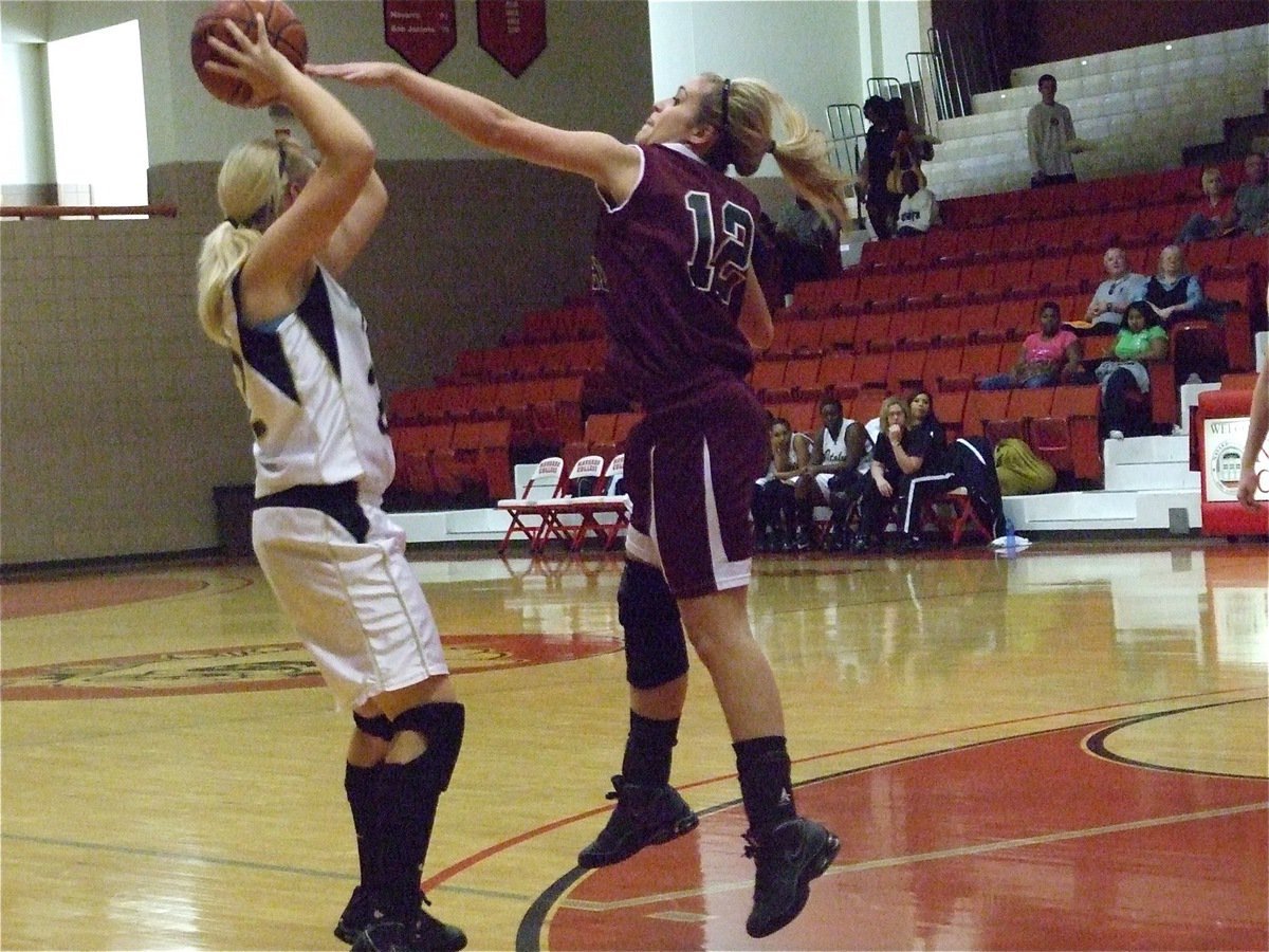 Image: Stay on 22! — Mildred’s defense try to keep a hand in the face of Lady Gladiator sharp shooter Megan Richards(22).