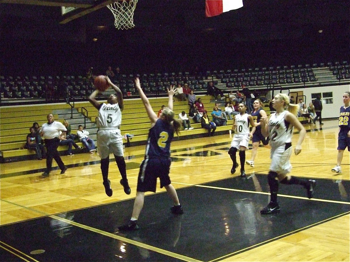 Image: Gimme five! — Jameka Copeland(5) takes what the Eagle defense gives her, 2-points.