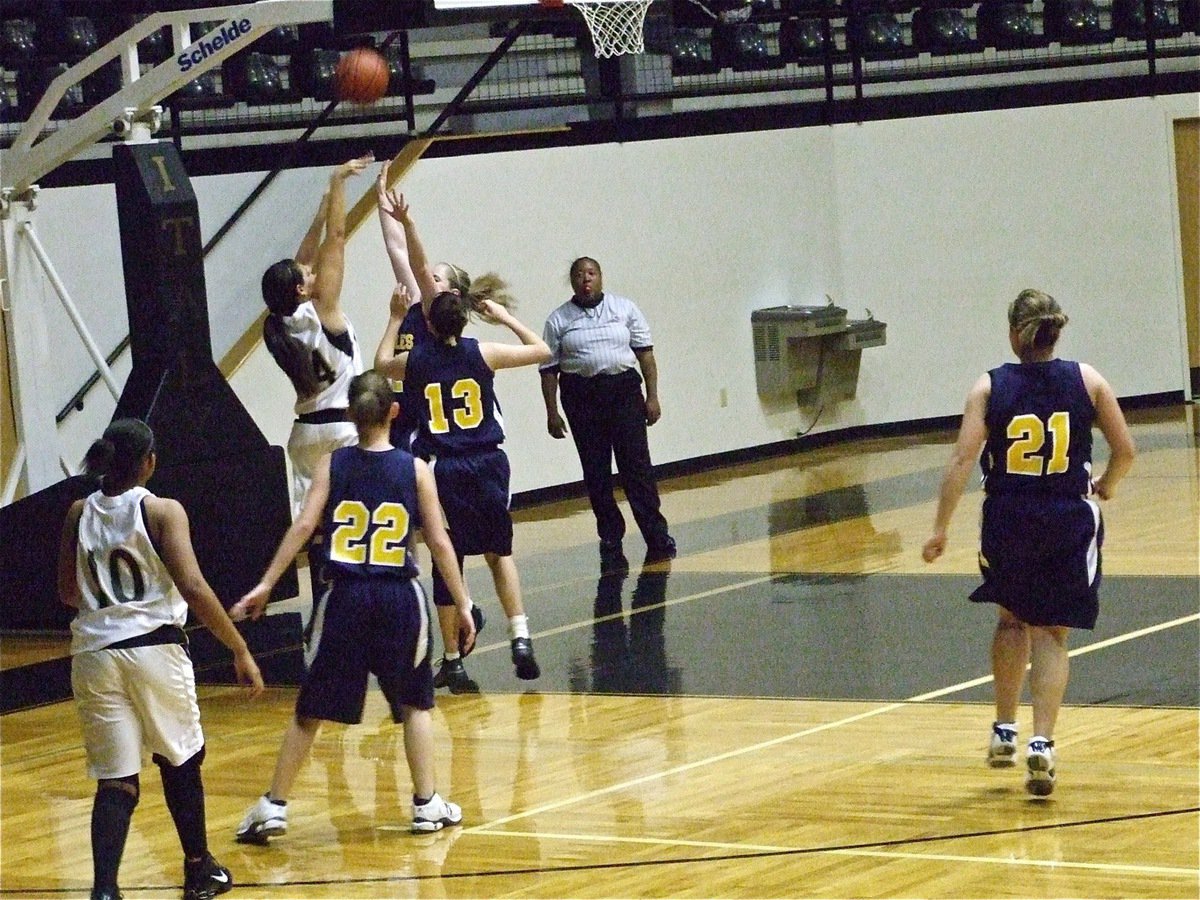 Image: Alyssa inside — Alyssa Richards(24) shoots over two Eagle defenders.