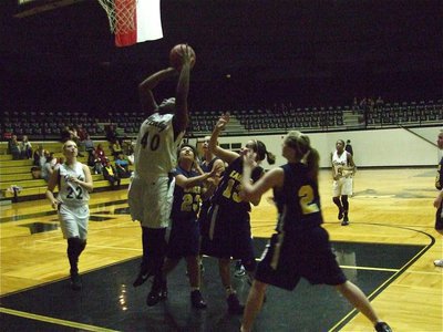 Image: REEDiculous — Easy pickings for Jimesha Reed(40) as she gets pecked by the Eagle defense on her way up.