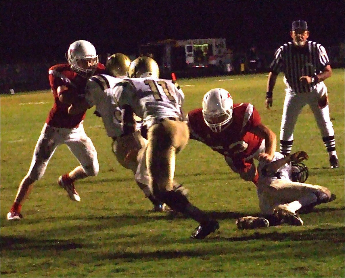 Image: Jasenio follows Justin — After a goal line stand by the Gladiator defense, Jasenio tries to give his offense some breathing room.