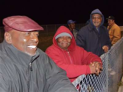 Image: On the fence — Jasenio’s dad and his pals enjoyed watching the game from the fence.