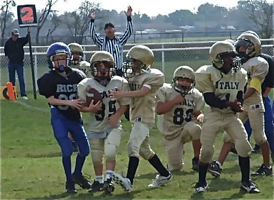 Image: Cason celebrates — Ryder “Phat” Itson congratulates Cason Roberts(99) for powering the ball into the endzone for Cason’s first career touchdown.