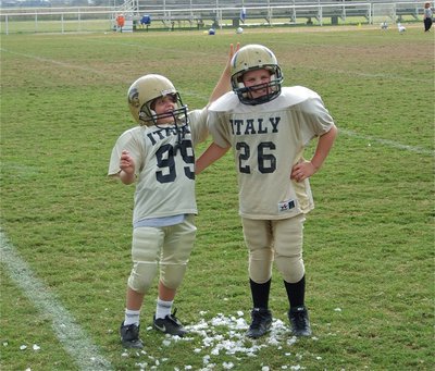 Image: Championship ice — Brothers, Cason Roberts(99) and Cade Roberts(26), pose on the championship ice after their win over Rice to be undefeated division champions. A special moment for these two as Cason followed his big brother Cade into the endzone for Cason’s first career touchdown.