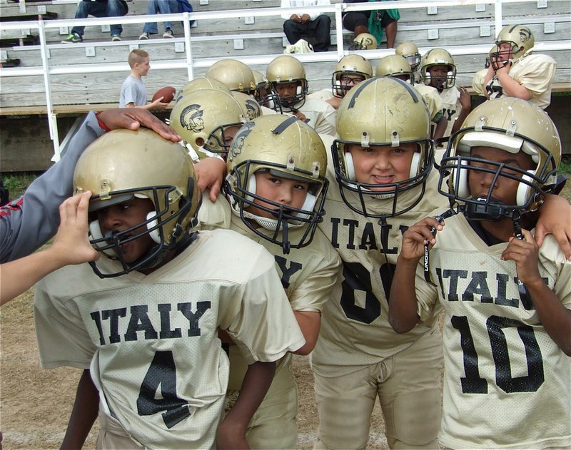 Image: Great job! — Celebrating their win, B-Team heads out for the handshake with Rice.