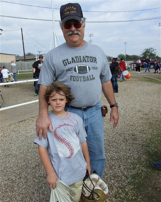 Image: Proud Grandpa — Cason Roberts gets a hug from his Grandpa, Larry Roberts, congratulating Cason on scoring his first touchdown.