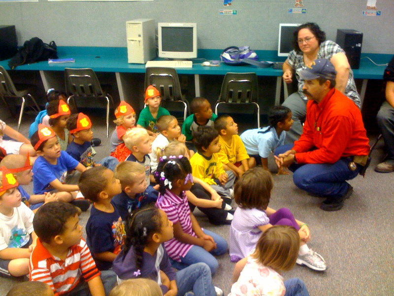 Image: The Class is Enthralled — Milford Fire Chief Mark Jackson talks to the students about fire safety.