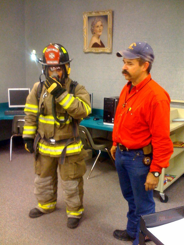 Image: Scary Huh? — Chief Jackson was telling the children not to be afraid when they see firemen in full gear. It is to protect the firemen, so they can protect you.