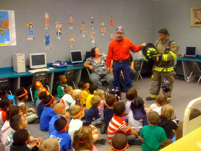 Image: Fire Helmet — Jackson is explaining about how the fire helmet keeps the firemen safe.