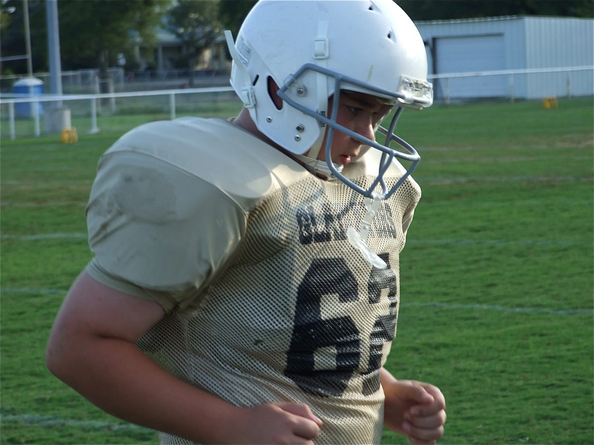 Image: Charge! — Kevin Roldan(62) was unblockable as he relentlessly charged into the Longorn backfield.