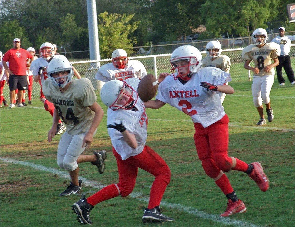 Image: Almost intercepted — Axtell’s hopes for a victory were just out of reach as they dropped the ball against the Gladiators.