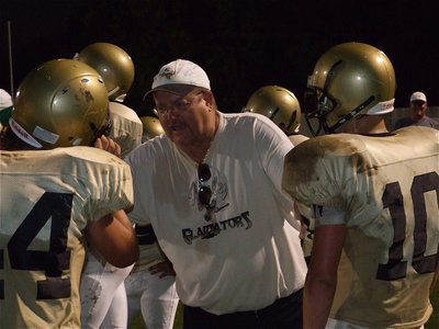 Image: Not another yard! — Coach Robert Sollers inspires his linebackers.