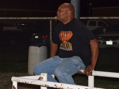 Image: Proud papa — Larry Mayberry finally relaxes to watch lil’ Larry and his teammates win over Axtell.
