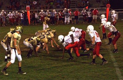 Image: Anywhere…anytime… — Italy’s JV goes head-to-head against Axtell near midfield and somewhere between the down markers.