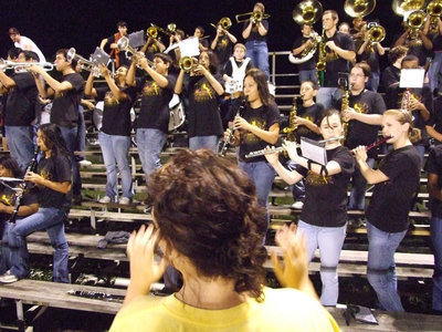 Image: Molly and the band — Drum Major Molly Haight conducts the Italy Band.
