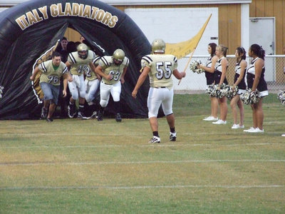 Image: Ross leads the way — Senior Ross Enriquez #55 leads the way for the Gladiators.