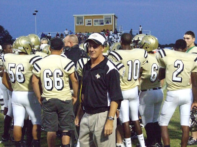 Image: Coach Holley — Coach Kyle Holley returns to the sideline after a time out.