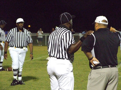 Image: I have a question — Coach Bales took a minute and talked to the referees about one of their calls.