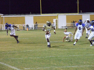 Image: Jasenio runs — Junior Jasenio Anderson searches for the receiver among the Chilton Pirate defense.