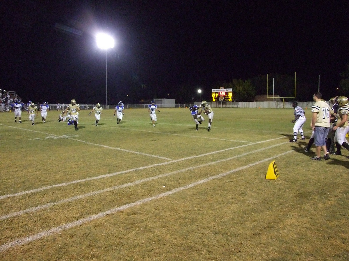 Image: Collision — Gladiators and Pirates clash all the way down the field.