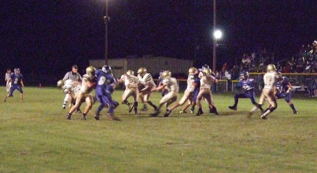 Image: Blocking the Bulldogs — Jasenio drops back to pass…or did he handoff the ball? Wortham’s defense doesn’t know either.