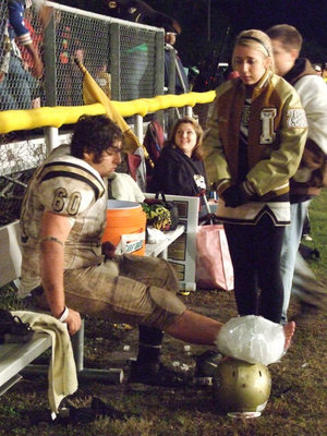 Image: One cold night — Lexie Miller consoles Ivan while he ices his injury.
