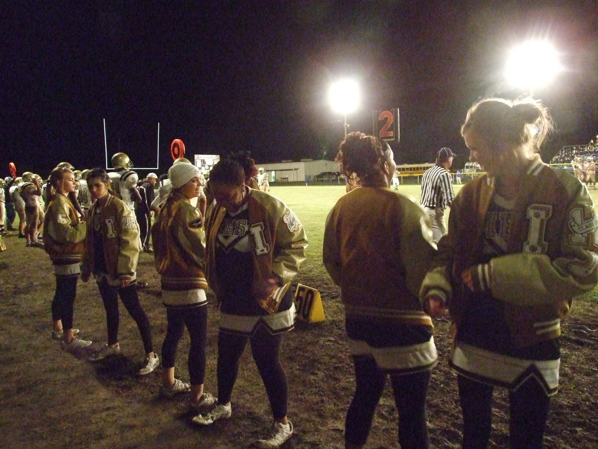 Image: Letters &amp; laughs — The Cheerleaders braved the cold in their letter jackets and had fun cheering.