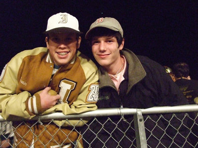 Image: Just chillin’ — Justin and Matthew chill at the game while keeping warm.