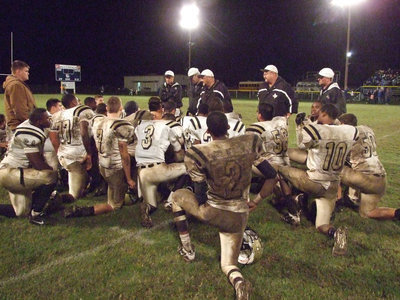 Image: Everybody’s in — Coach Bales and his coaching staff recap the pros and cons of the 35-12 win over the Wortham Bulldogs.