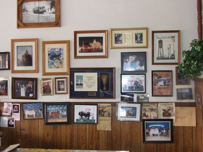 Image: Wall to wall — Customers have filled more than chairs. Clippings and photos of those that have hung out here, continue to hang in the Uptown Cafe.