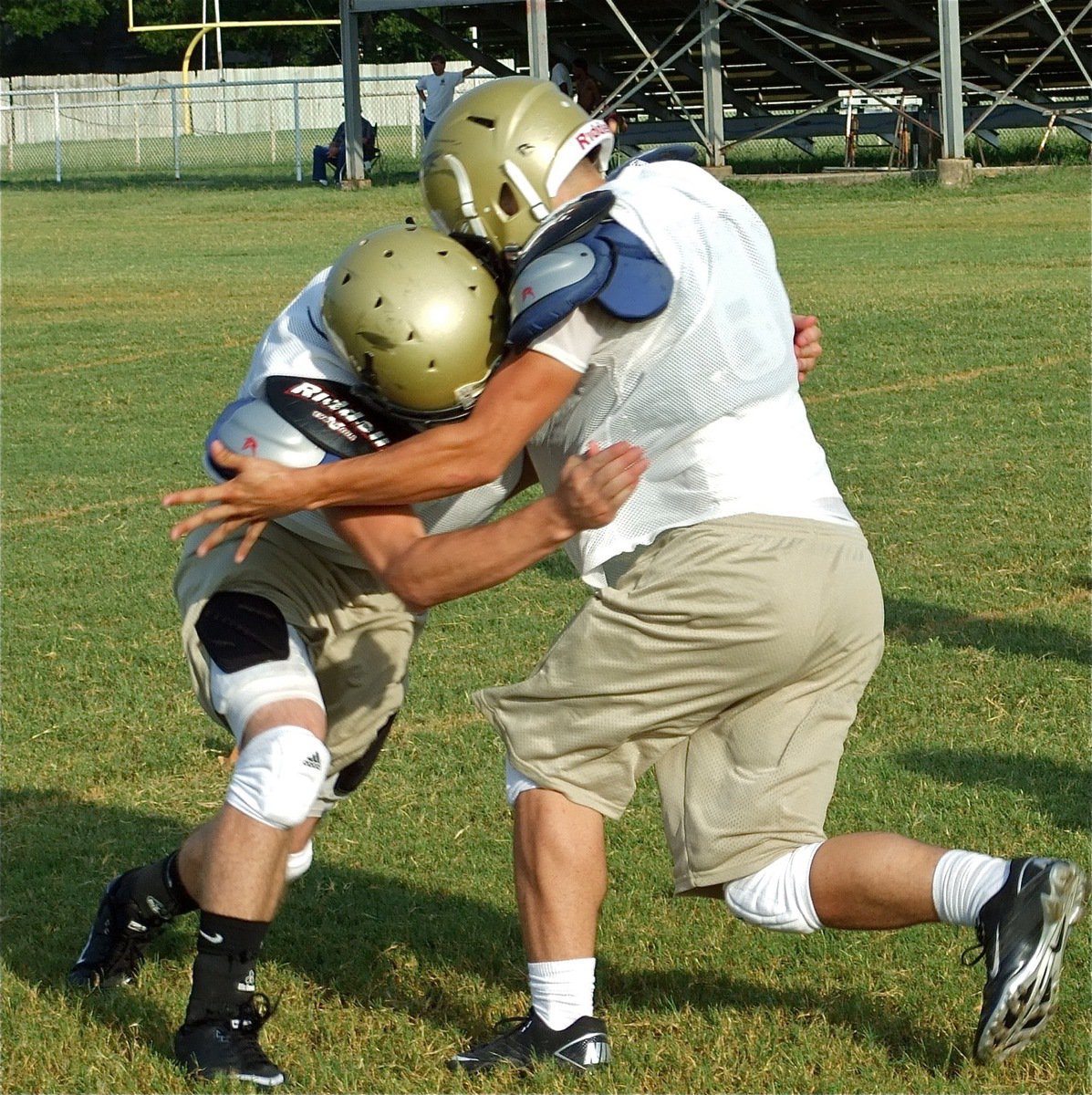 Image: Clack! — Linebackers Kyle Wilkins and Ethan Simon collide during a form tackling drill.