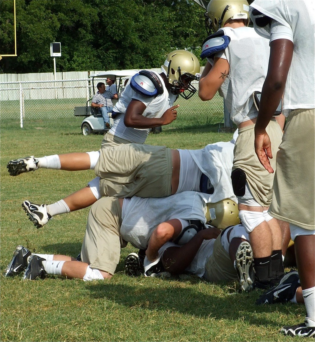 Image: Making sure — Wreckless abandonment. Kyle Jackson dives on to ensure the tackle has been made.