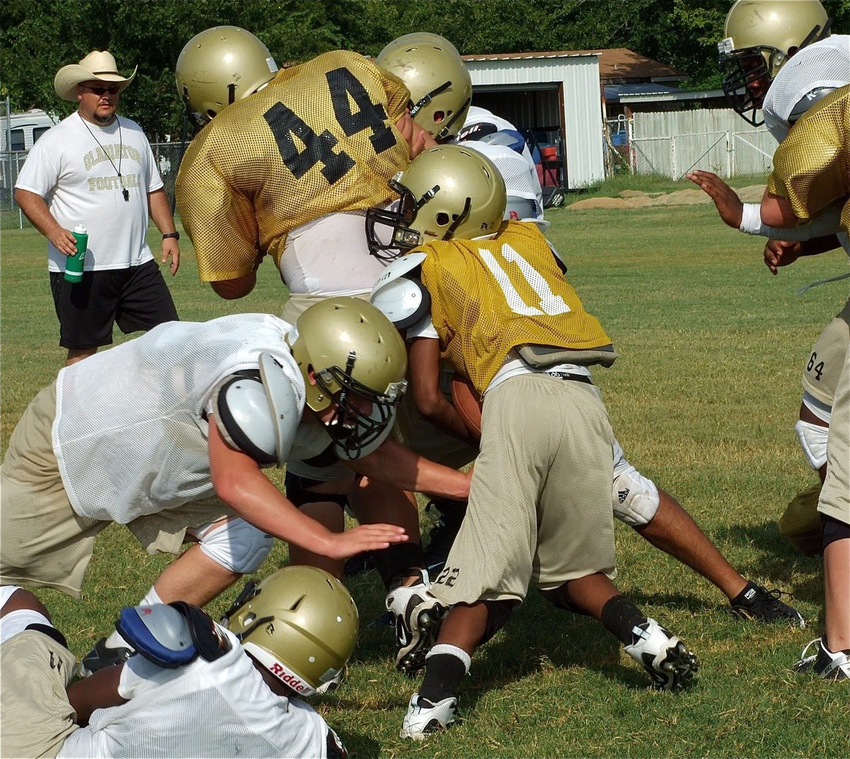 Image: Searching for daylight — Eric Carson(11) tries to wiggle his way thru the defense.