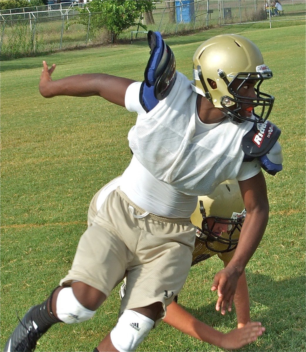 Image: Ironman — Jasenio Anderson swoops in on defense.