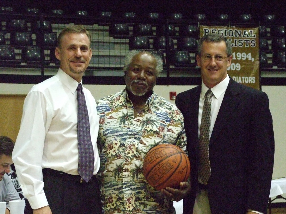 Image: Ervin Green acknowledged — Scott Herald and Coach Holley presented Ervin Green with a signed Varsity Boys basketball.