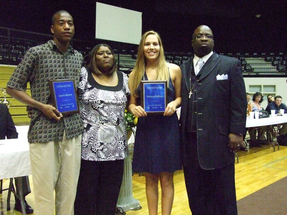 Image: Keith Davis awards — (L-R)Darrin Moore, Brenda Davis, Becca DeMoss and Pastor Preston Dixon.