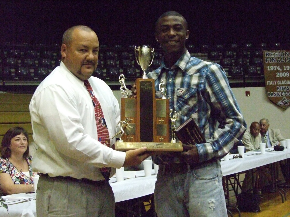 Image: Jimmy Davis Award — Coach Bales presents Diamond Rogers with this prestigious award.