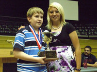 Image: Brett Kirton &amp; Megan Richards — 2008 winner, Megan Richards, hands the Oliphant Cup to 2009’s winner, Brett Kirton.