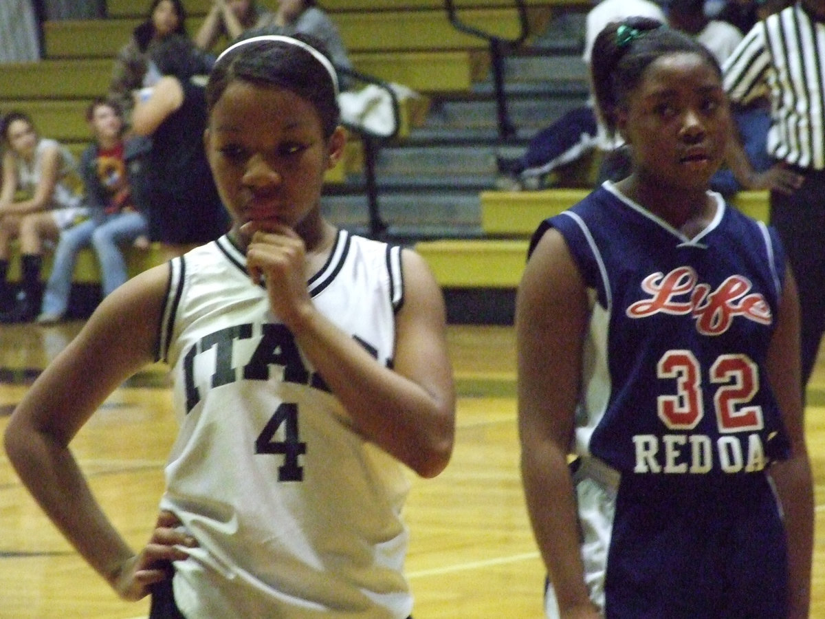 Image: Figuring It Out — Italy’s #4 Ryisha Copeland tries to figure out a way to rein in Red Oak Life. In the end, the ROL Mustangs trotted off the court with a 16-13 win.