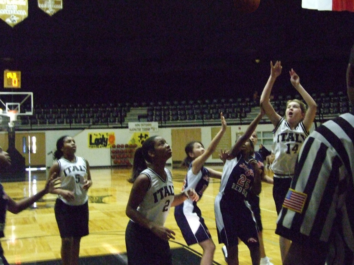 Image: Taylor For Two — Italy’s #14 Taylor Turner goes up strong against Red Oak Life inside the dome.