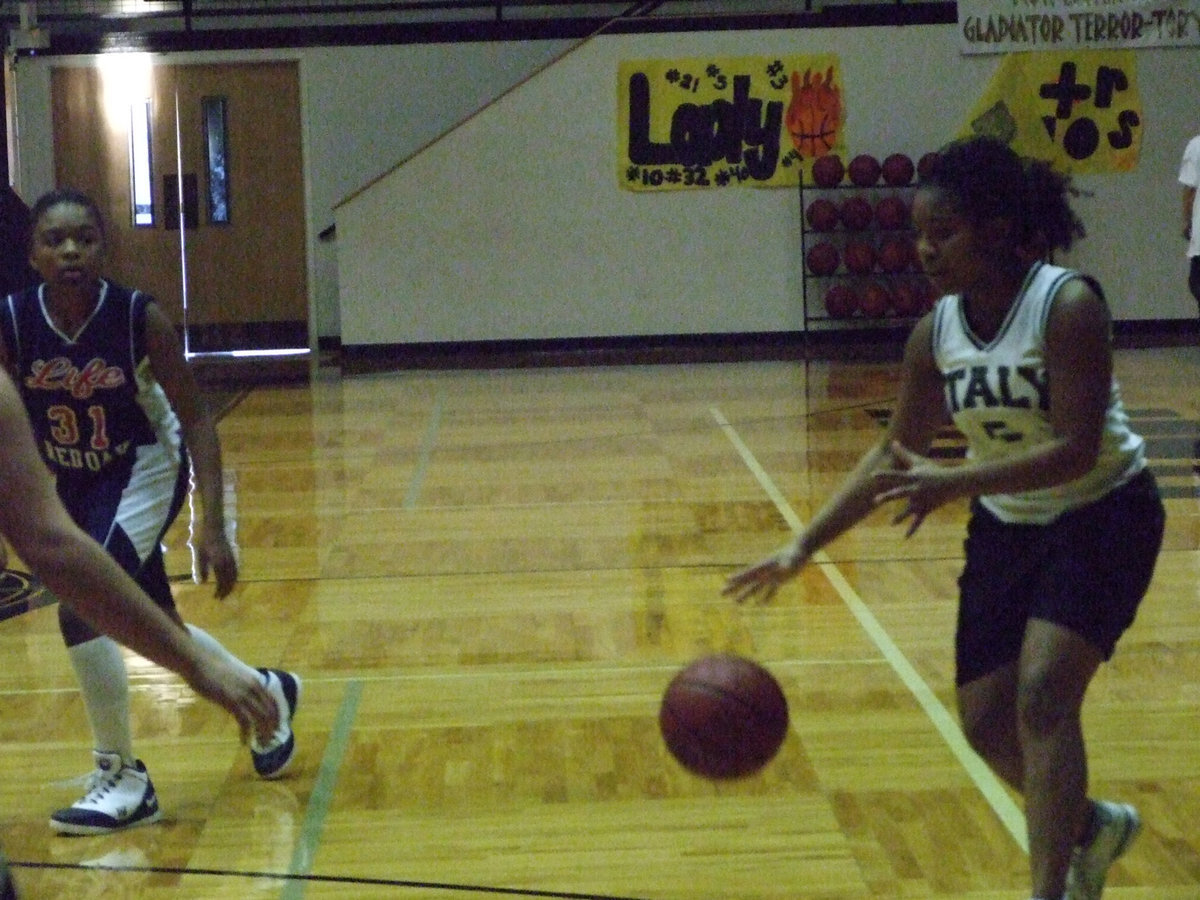 Image: Harper Advances — Italy’s #5 Ashley Harper advances the ball toward Red Oak Life’s basket.