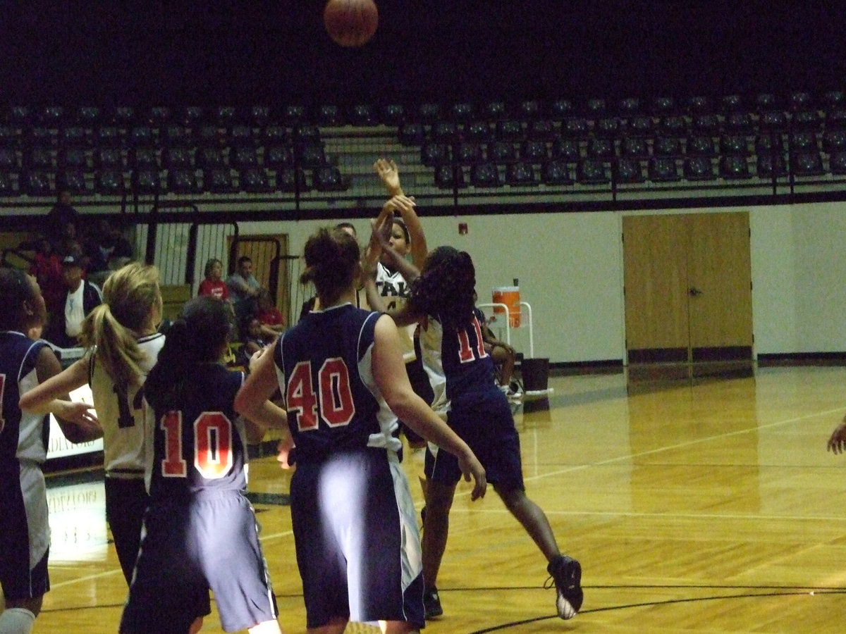 Image: Ryisha For A Swisha — Italy’s #4 Ryisha Copeland takes a jump shot against the Mustangs.