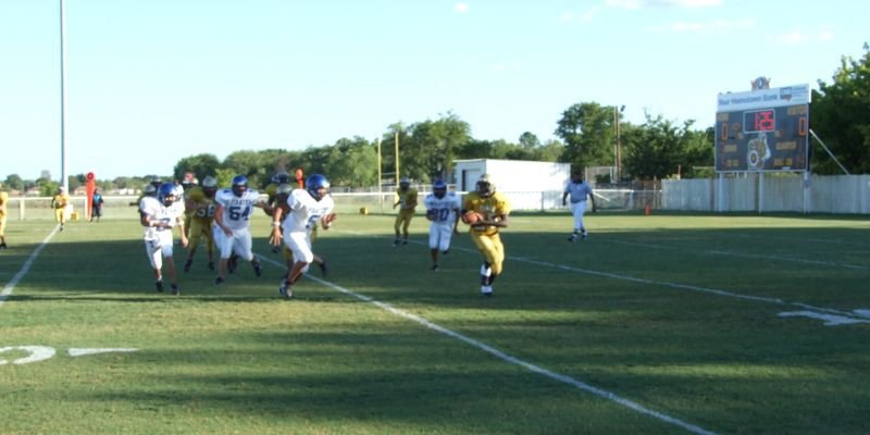 Image: Gladiator run play — Corrin Frazier runs past the line of scrimmage, deep in Gladiator territory.