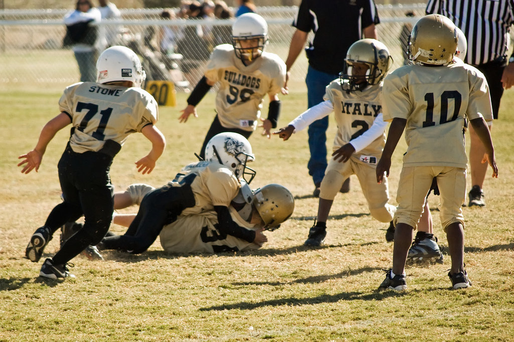 Image: Diving Ahead — 34-Corbin Schrotke is pulled down by a Palmer defender.