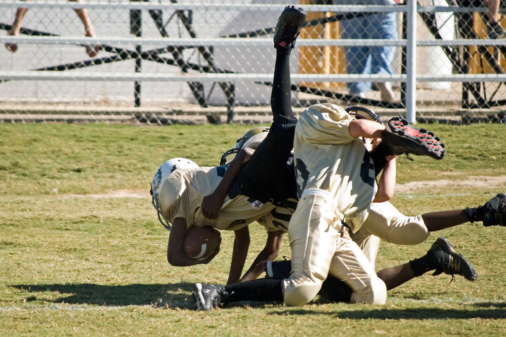 Image: Hangin’ On — 80-Isaac Salcido and 20-Chasston Wilson are determined to keep this Palmer Bulldog out of Italy’s endzone.