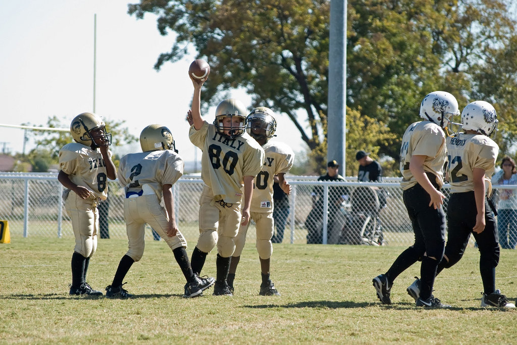 Image: “Mama!  I Got The Ball!” — 80-Isaac Salcido goes all Mud Dawg on the Palmer offense and recovers the football.
    He loves his Mama!