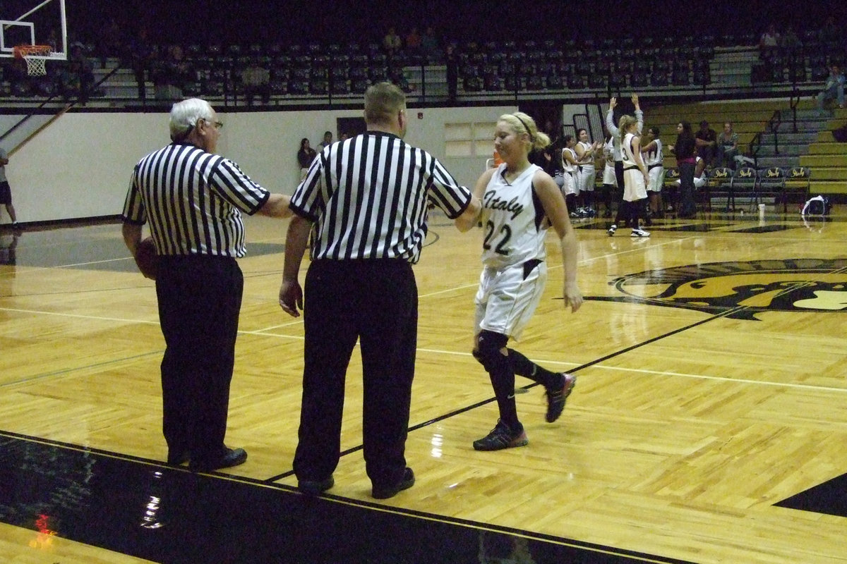 Image: Richards Greets — Megan Richards #22 welcomes the referees and Mildred coach and team to the Italy Gladiator Coliseum on Tuesday night.